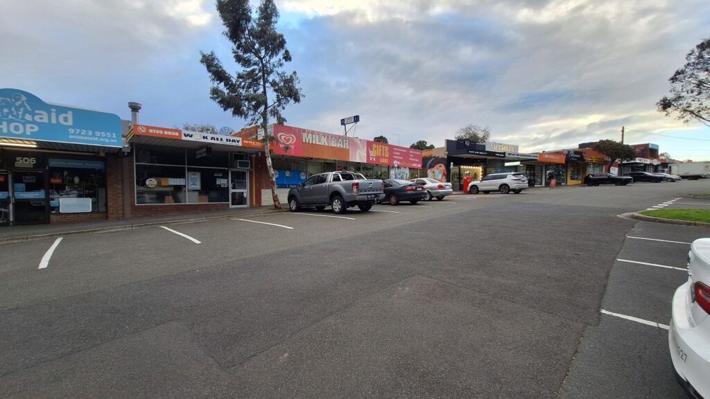 Merrindale Shopping Centre shopfronts and car park on Dorset Road in Croydon