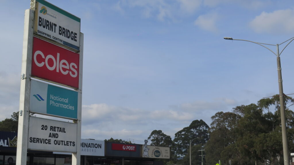 Burnt Bridge Shopping Centre sign and shopfronts in Ringwood