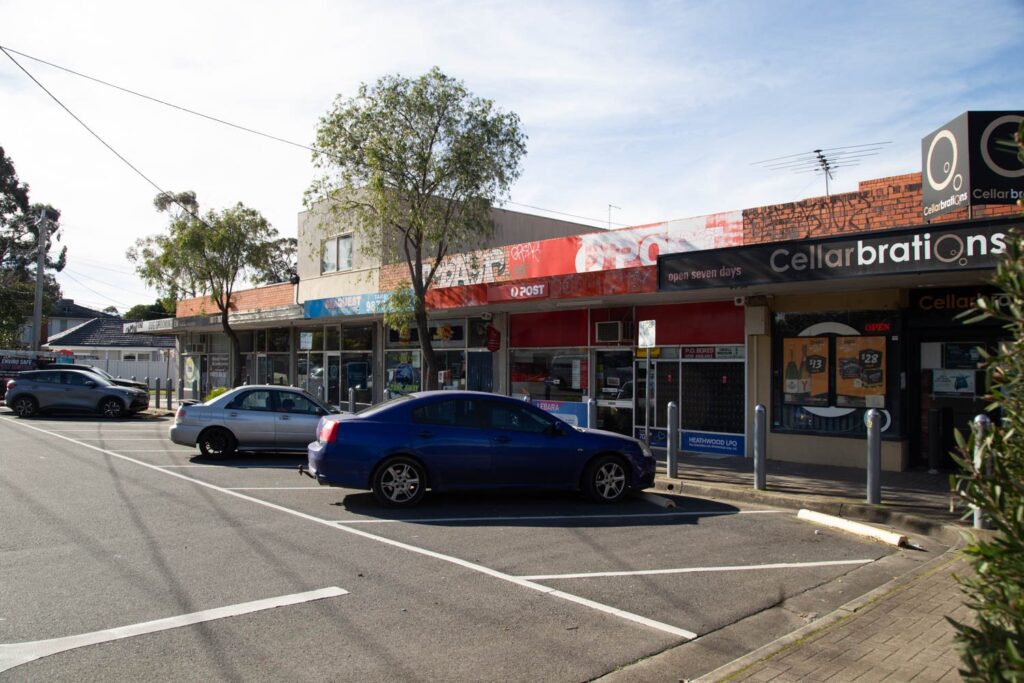 Shopfronts and parking at Heathwood Shopping Centre in Ringwood