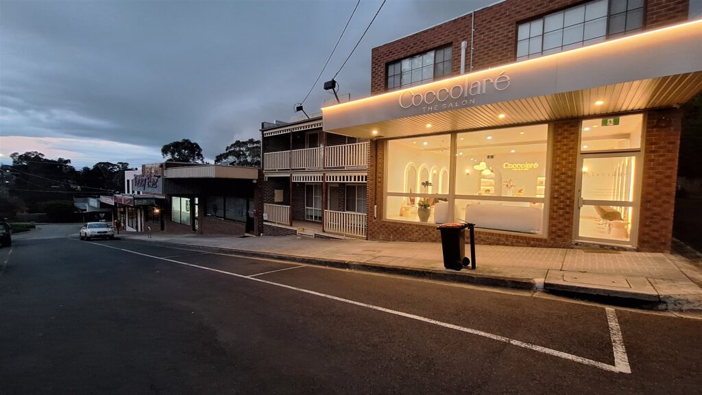 Little John Road Shopping Centre shopfronts in Warranwood at dusk