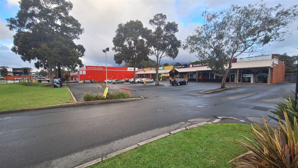 Eastwood Plaza shopfronts and parking on Canterbury Road